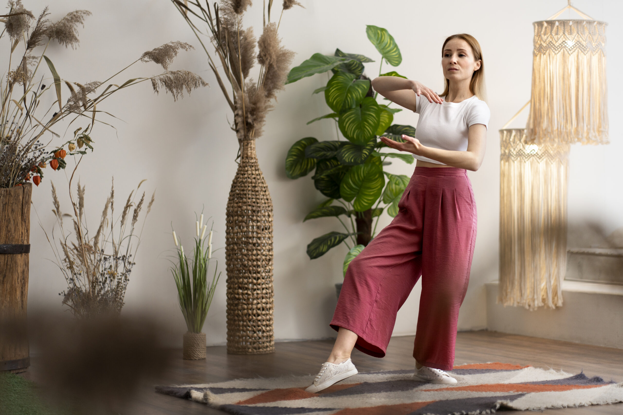 person-practicing-tai-chi-indoors